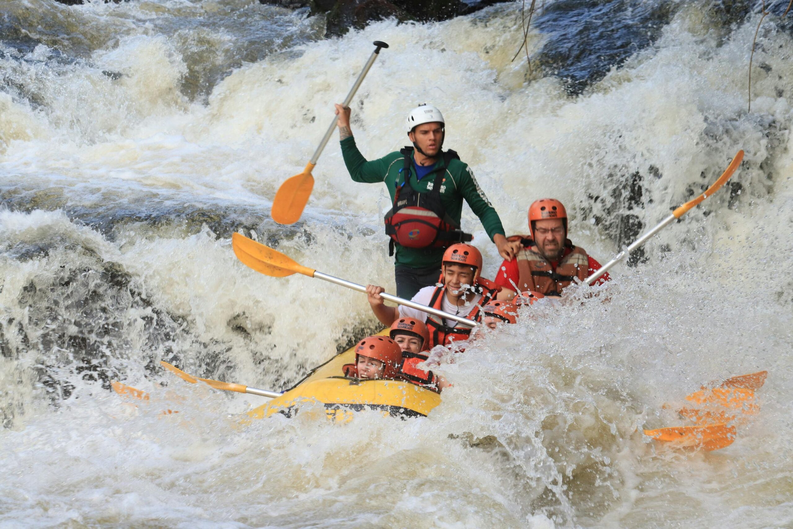 Thrilling whitewater rafting experience in Brotas, Brazil, with a group navigating rapids.