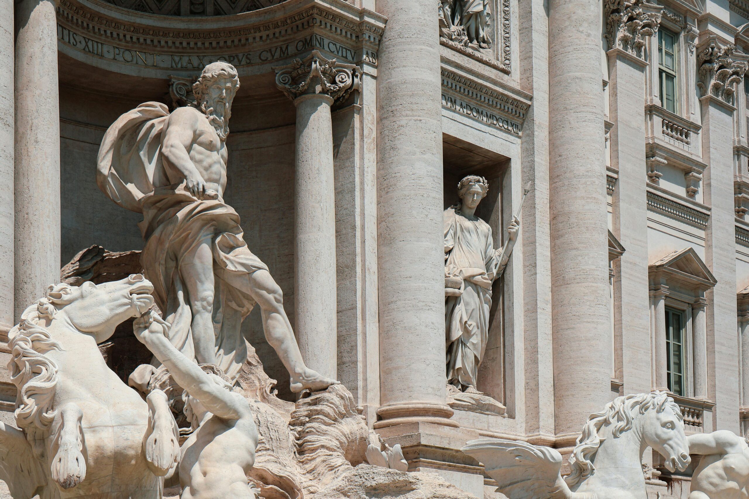 Close-up of the majestic sculptures at the iconic Trevi Fountain in Rome, showcasing baroque artistry.
