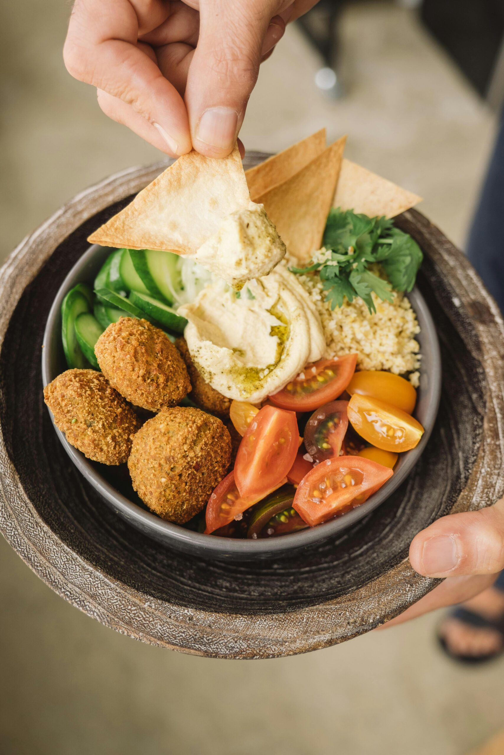Delicious Mediterranean bowl with falafel, hummus, and fresh veggies.